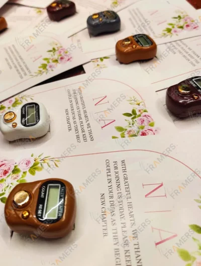 Close-up of digital tally counter on customized Nikkah favor card