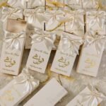 Gold foil Qubool Hai calligraphy on tall bid boxes sleeve