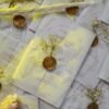 Multiple white vellum wedding cards with wax seals flat lay